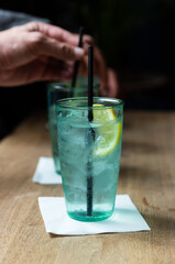 gin with lemon and black straw