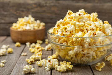 Salty popcorn on bright color background. Cinema and entertainment concept. Movie night with popcorn. Delicious appetizer, snack.Space for text, copy space. Banner
