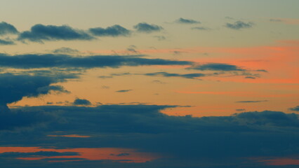 Wonderful view of sky and clouds with sun from above. Red purple orange blue pink sunset sky cloud. Timelapse.