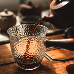 Experience elegant tea pouring with stunning textured glassware that enhances the moment