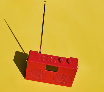 Red radio on yellow table