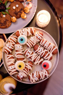 Funny Halloween food with mummy sausages and eyes on a plate