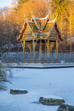 Thai Sala with Buddha statue in snowy Westpark, Munich during winter