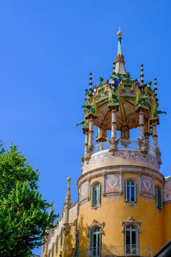 Ornate tower at Avenida del Tibidabo in Barcelona Spain with a clear blue sky