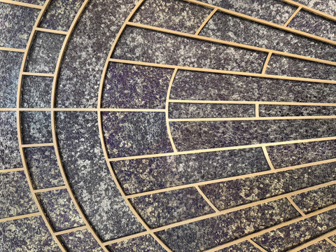 Art deco wall decoration panel with gold paint curves and arches with stained glass background. This type of design is famous with sunburst pattern of art deco design style.