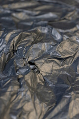 a piece of black soft paper for packaging goods and objects