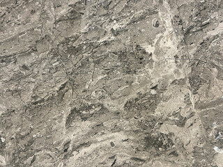 Natural brown grey marble with random abstract texture. Luxurious rare type light brown, white, beige, and grey natural marble stone, Seamless background texture.