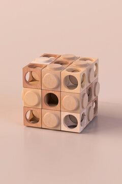 Wooden geometric pieces forming an abstract structure with holes.