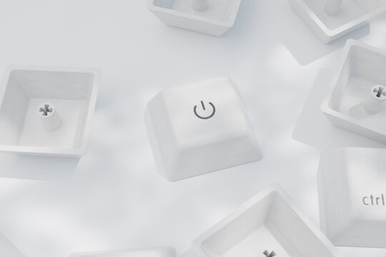 Closeup of power button on white keyboard keys.