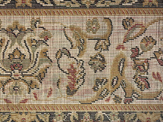 Close up of flower and floral ornament pattern in shades in vintage brown, red, gold, and beige...