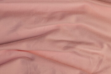 details of a part of the pink fabric that is used to make clothes