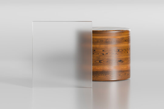 Semi-transparent glass in front of a wooden cylinder indoors.