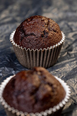 fresh and soft black chocolate cupcake on black paper