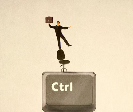 Businessman balancing on an office chair holding a briefcase on an oversized control key.