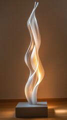Modern abstract sculptural art in soft lighting featuring fluid spiral design