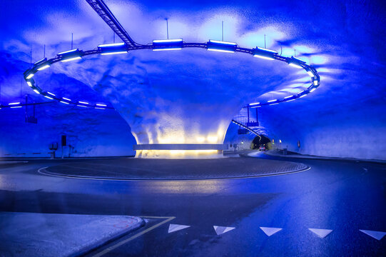 Kinsarvik Tunnel with a futuristic blue-lit traffic circle in Norway