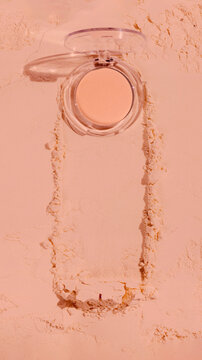 Compact powder foundation product shot in a minimalist setting