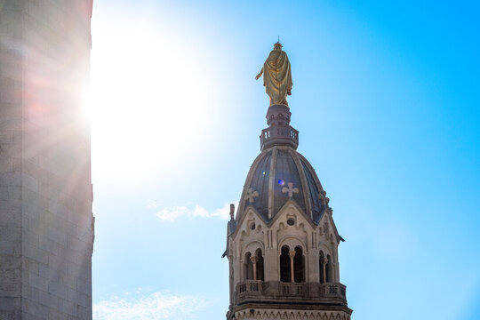 The dome of the Cathedral Saint-Jean in Lyon, France under a sunny blue sky