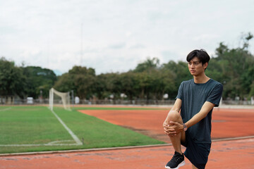 Athlete stretching routine local track field photographic scene outdoor sports environment dynamic viewpoint fitness concept