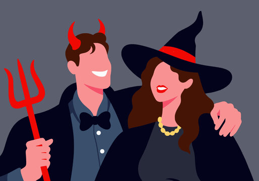 A couple dressed as a devil and a witch playfully smile at each other