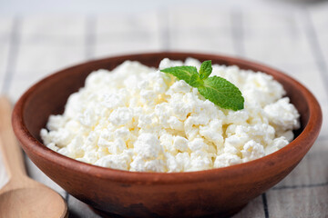 Cottage cheese in bowl, dairy product rich in protein and calcium