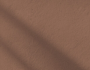 mocha mousse wall background rough texture textured shadow and light color of the year 2025