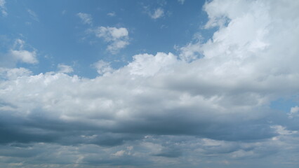 Obraz premium Gray rainy clouds float across dark sky. B roll sky and dark cloud. Nature environment dark huge cloud sky. Timelapse.