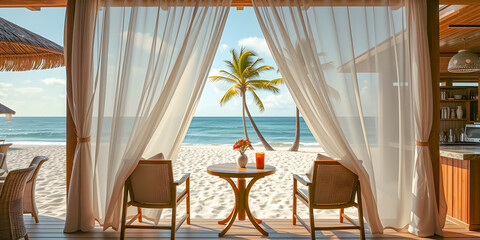 Obraz premium Outdoor restaurant at romantic beach. Table setting at tropical coastal restaurant. Cozy moody wooden tables, chairs under beautiful sunny sky, curtains and sea view. Luxury hotel or resort restaurant