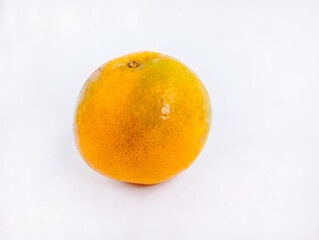 Ripe orange on a white background 