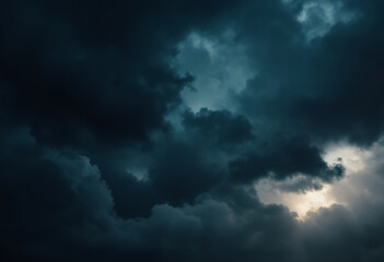 Fototapeta premium Dramatic dark storm clouds filling the sky, creating a moody and ominous atmosphere