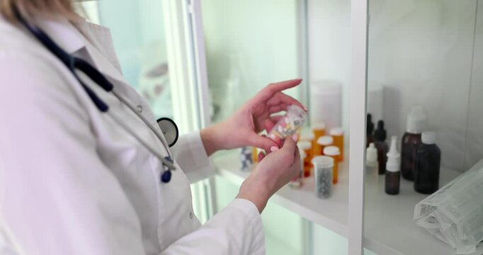 A healthcare provider diligently examining various medication products in a specialized clinical environment