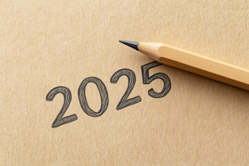 handwritten 2025 on textured paper with pencil