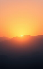 Fototapeta premium Sunset Over Silhouetted Mountain Range Landscape
