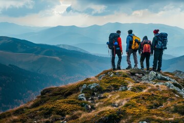 Obraz premium Four hikers stand at a viewpoint, overlooking breathtaking mountains and valleys, experiencing the beauty of nature during their outdoor adventure.