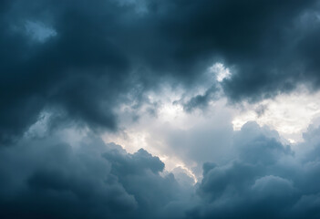 Obraz premium Dramatic dark storm clouds filling the sky, creating a moody and ominous atmosphere