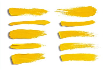Obraz premium A set of yellow brush strokes on a white background