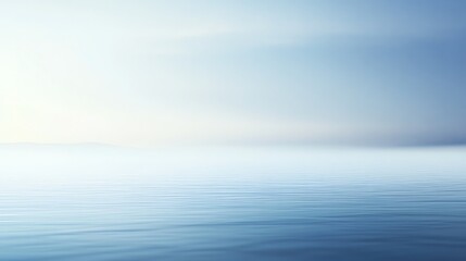 Fototapeta premium A calm, serene ocean at sunset, with a soft blue and pink sky.