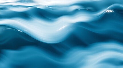 Obraz premium Abstract Aqua Flow: A mesmerizing abstract close-up of swirling, flowing, blue and white liquid. The soft, organic shapes create a sense of movement and serenity.