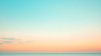 Fototapeta premium A soft, blurred image of the ocean and sky at sunset in pastel colors.