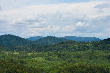 A scenic view of mountains to the north, seen from a lookout point on the road above Lokve Lake (Lokvarsko jezero) in Croatia