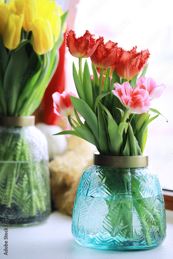 Wall mural Tulip flowers close-up in a vase. Mothers Day.