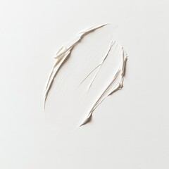 Creamy white makeup swatch spread on a smooth surface for a natural look