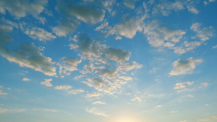 Romantic colorful gold orange clouds and blue sky. Tranquil nature cloudscape. Time lapse.