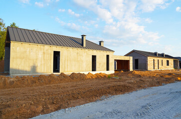 Suburban house Construction. Villa construction. New house construction. Home building. Modern...
