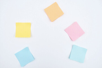 Five sticky notes white surface colors corners arrangement layout