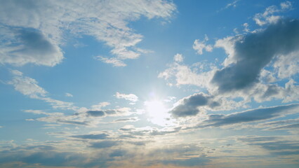 Solar energy concept of bright sun ray. Building clouds and sun rays breaking through cloud mass. Timelapse.