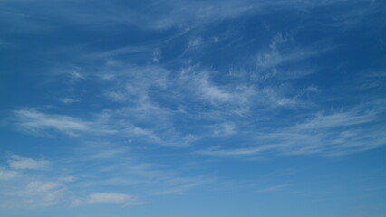 Fototapeta premium Blue sky cirrus clouds. Scenic aerial background of blue sky with cirrus clouds. Clean azone layer. Timelapse.
