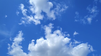 Azure Sky with White Clouds: A stunning and serene backdrop of a bright blue sky,  dotted with fluffy white clouds, evoking feelings of peace, optimism, and possibility.