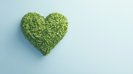 A heart shaped from green foliage against a light blue background, symbolizing love for nature and environmental awareness.