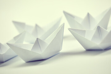 paper boats on the documents